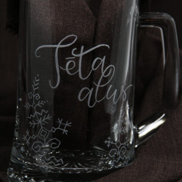 A beer mug for dad, but maybe someone else, with stylized patterns.